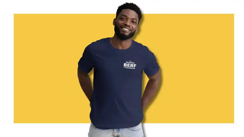 Person wearing a The Bear t-shirt on a yellow background