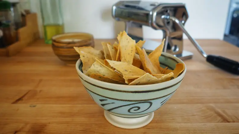 Crackers made from pasta dough are inside a bowl.