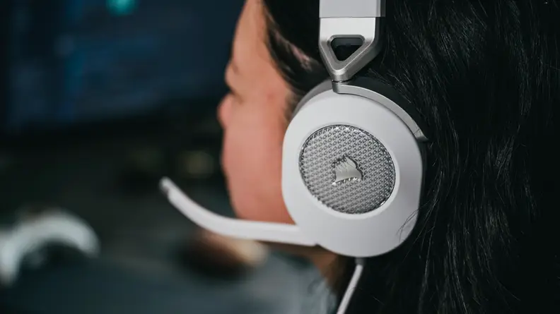 Close up of a person wearing a headset with microphone.