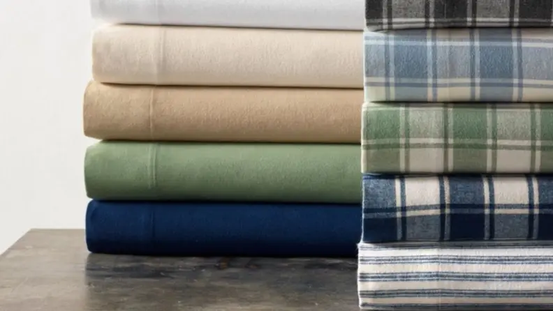flannel LL Bean sheets stacked on a table in various colors and plaid