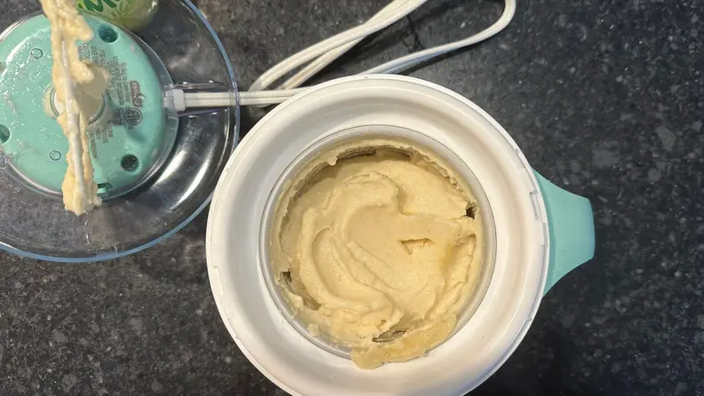 The Dash My Mug Ice Cream Maker with prepared mango sorbet ready to be served.