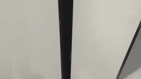 Hand using the Auto Open Door feature to open the fridge door