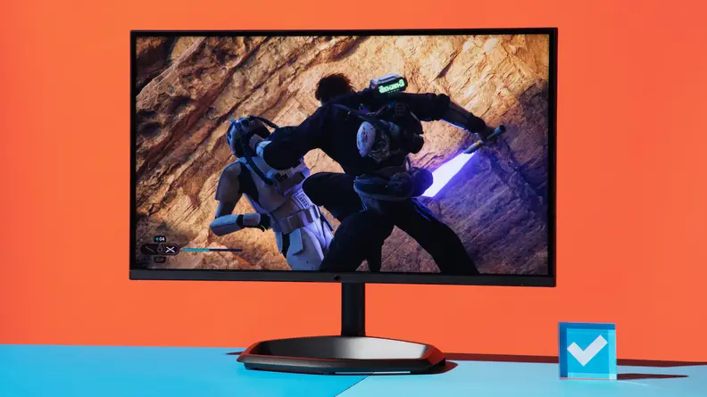 Product shot of the Cooler Master Tempest GP27Q gaming monitor on top of blue surface.