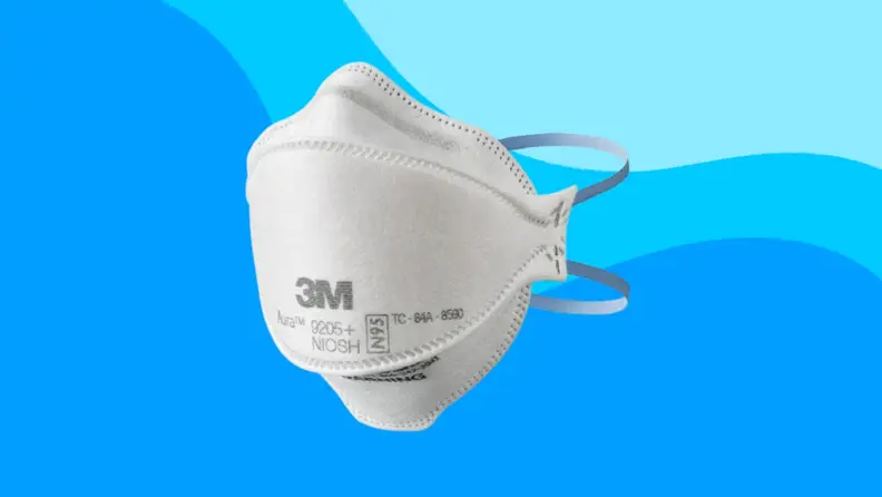 A 3M N95 mask on a blue background.