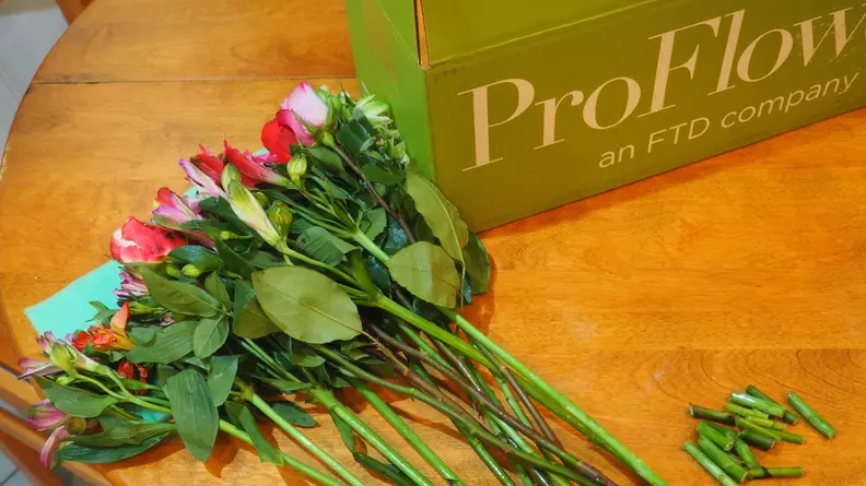 Flowers with stems cut off on table