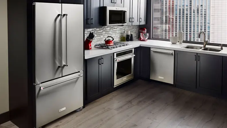 The KitchenAid KRFC300ESS counter-depth fridge, installed in a modern kitchen.
