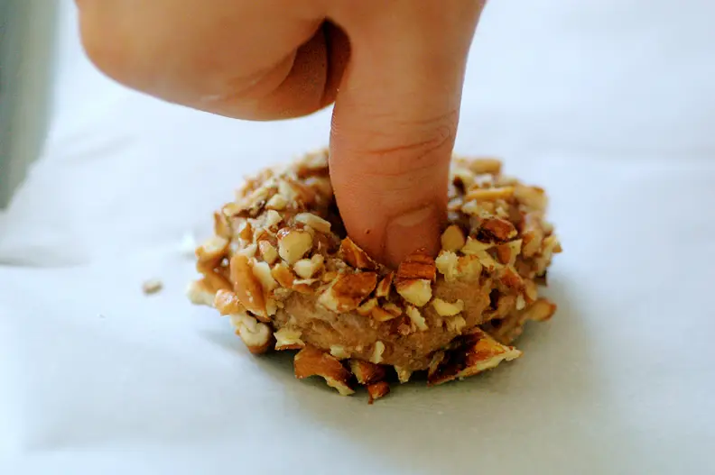 thumb making indent in cookie