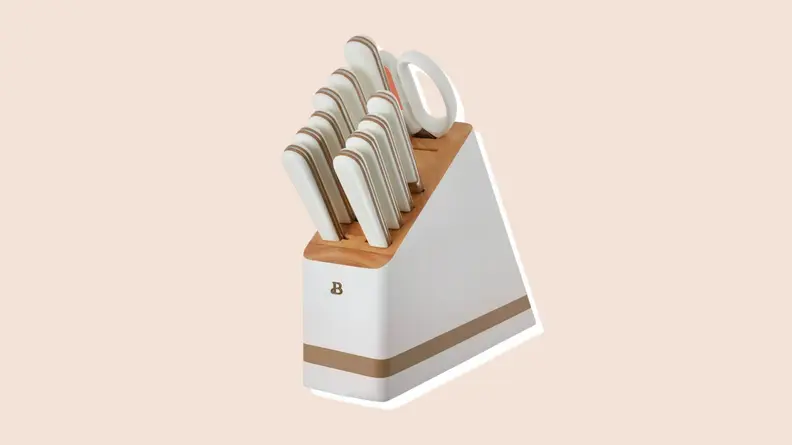 Product shot of knife block with white knives inside from the Beautiful by Drew Barrymore Kitchen Appliances line.