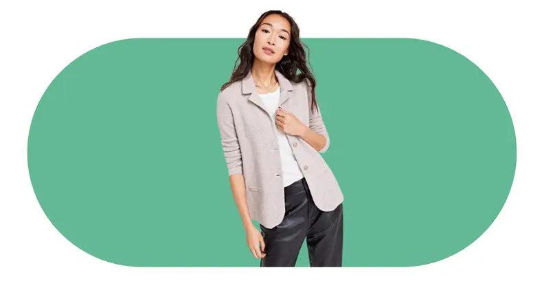 A model wearing an unstructured cashmere blazer with leather pants.