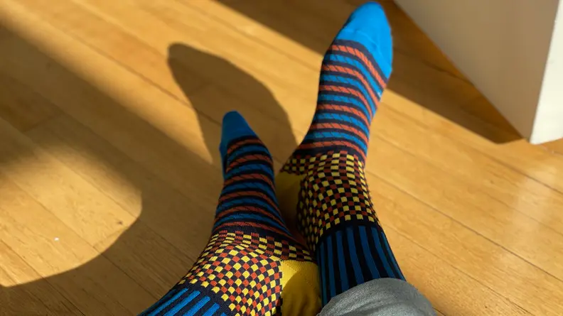Funky socks on wood floor
