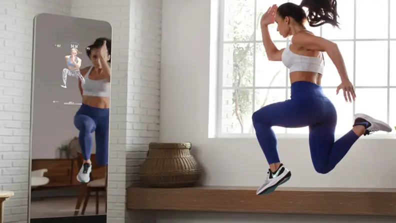 woman exercising in front of proform vue.