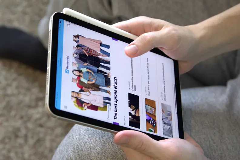 Hands holding a computer tablet