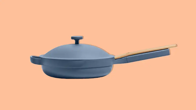 The Our Place Always Pan 2.0 in Blue Salt color with an orange background.