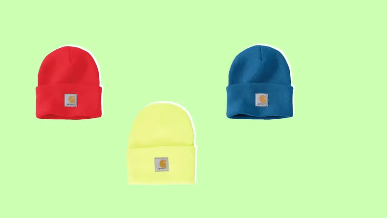 Three different colored carhartt beanies on a light green background