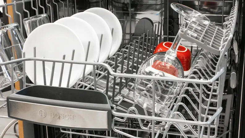 A close-up view of the top rack of the Bosch dishwasher.