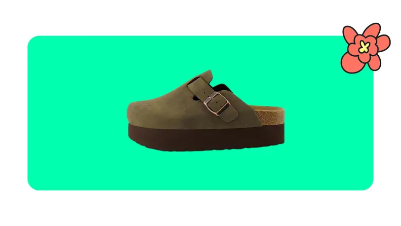 Green cushionare platform clogs with brass buckle on a green background