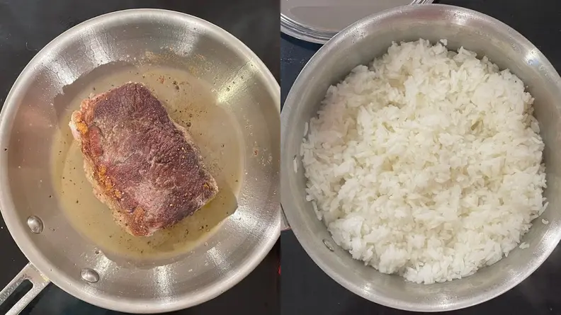 A seared steak and cooked rice inside of stainless steel All Clad pot and pan.