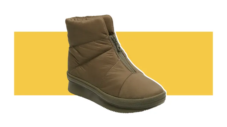 Brown Keds puffer boot against yellow background