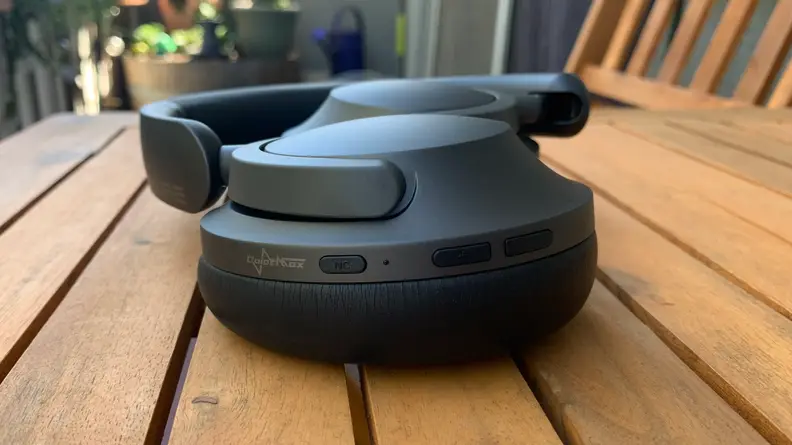 The headphones sitting on a bench.