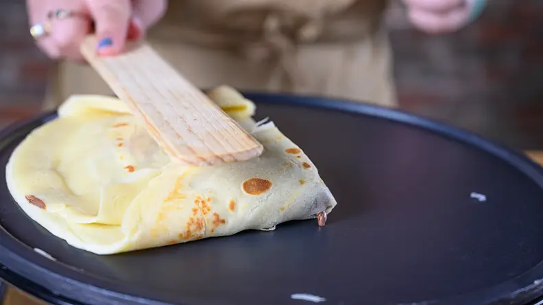 Fold the crepes once they're filled and done cooking.