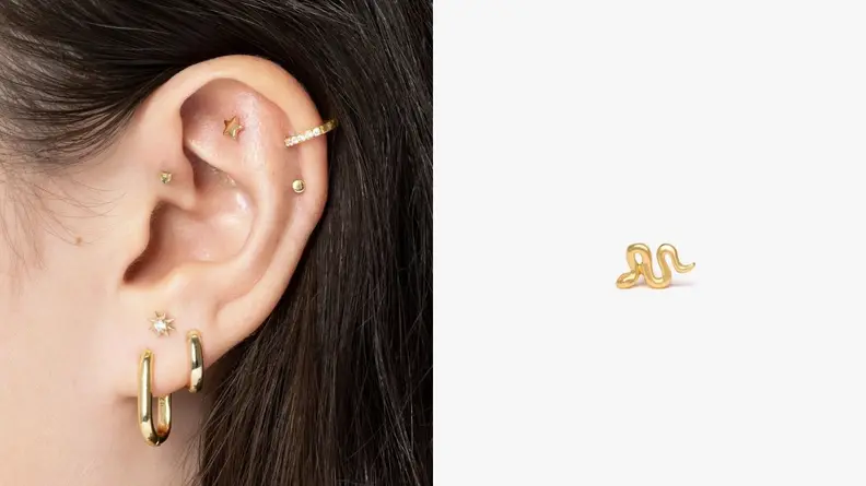 ear with earring from Studs in it, single serpent earring in gold