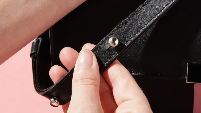 Close-up photograph of the leather strap on the Behno Simone Double Base Crossbody bag.
