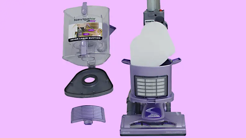 A close-up of the canister area of the vacuum, with its filter disassembled.