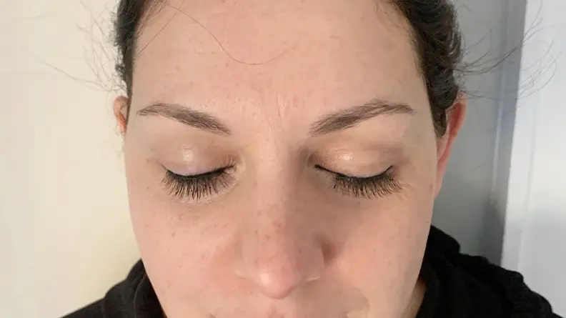 A closeup of the author's eyes closed while wearing the Lola’s Lashes Rose Quartz Magnetic Eyelashes and Eyeliner Kit.