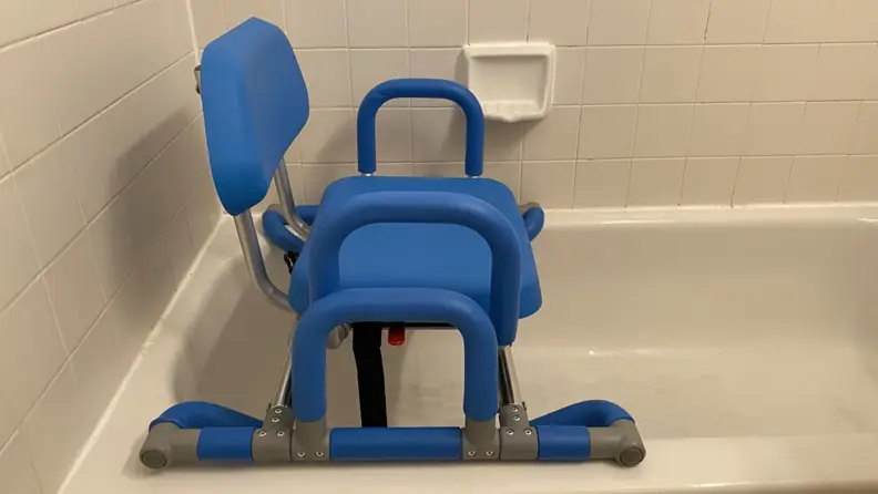 HydroSlide shower chair attached to bathtub.