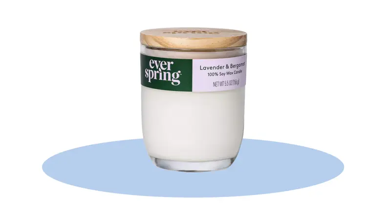 The Ever Spring Lavender and Bergamot Candle in front of a background.