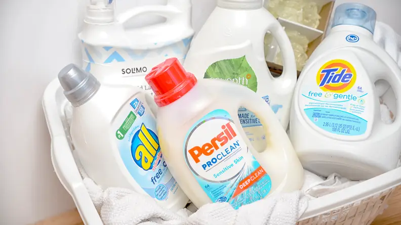 A laundry basket filled with detergents for sensitive skin