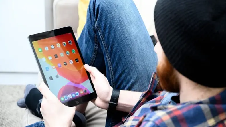 Image of person looking at iPad screen