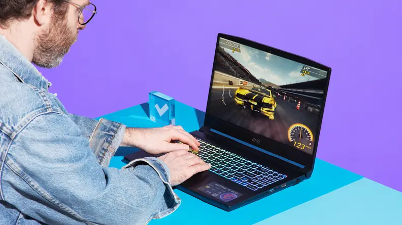 A person playing a racing game on the MSI Katana 15.