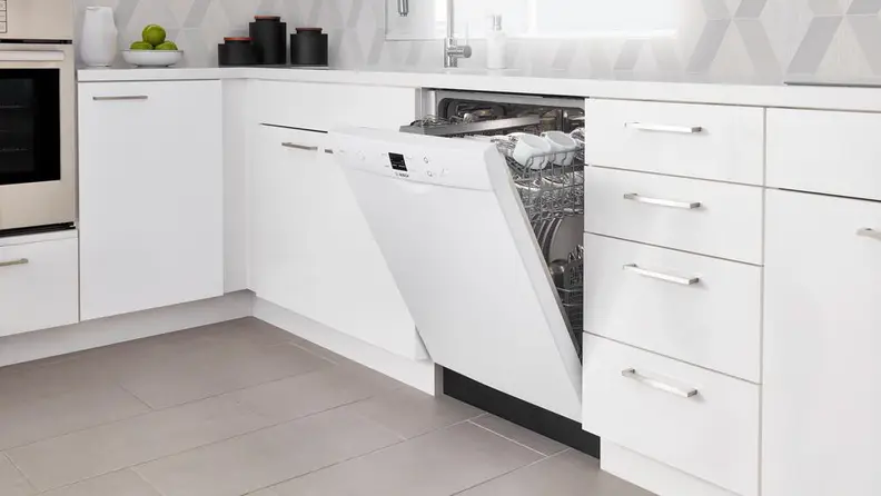 The Bosch SHEM3AY52N installed in a white kitchen.