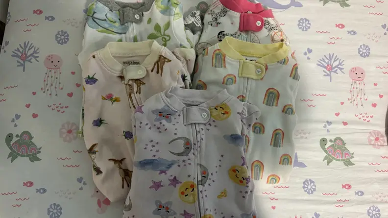 Burt's Bees Baby onesie next to each other.
