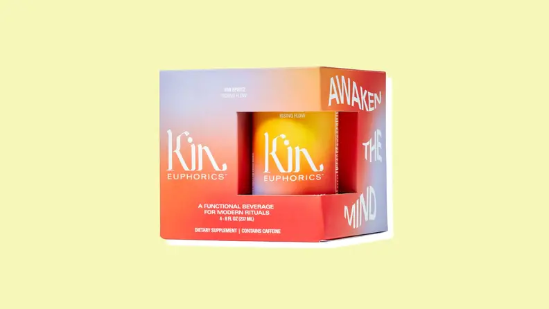A box of Kin Spritz cans on a yellow background