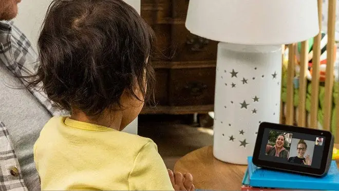 A child looking at the Amazon Echo Show 5 display.