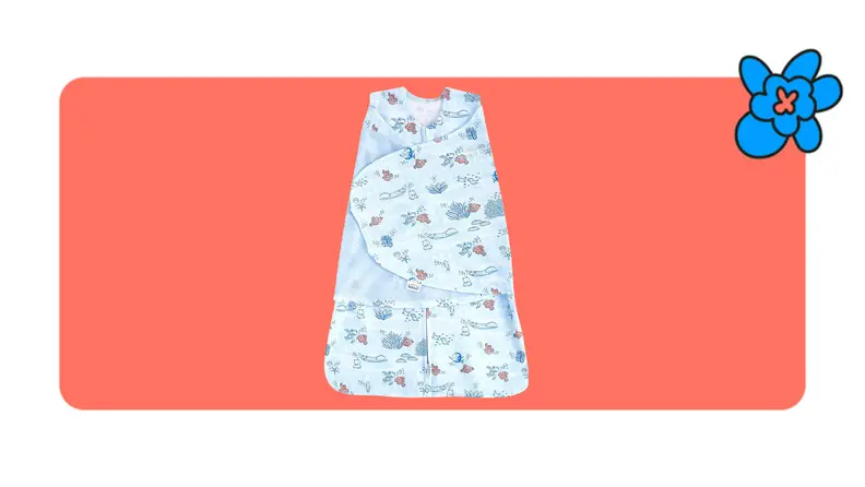 A printed Halo Sleep Sack for babies in front of a red background with a blue cartoon flower in the corner.
