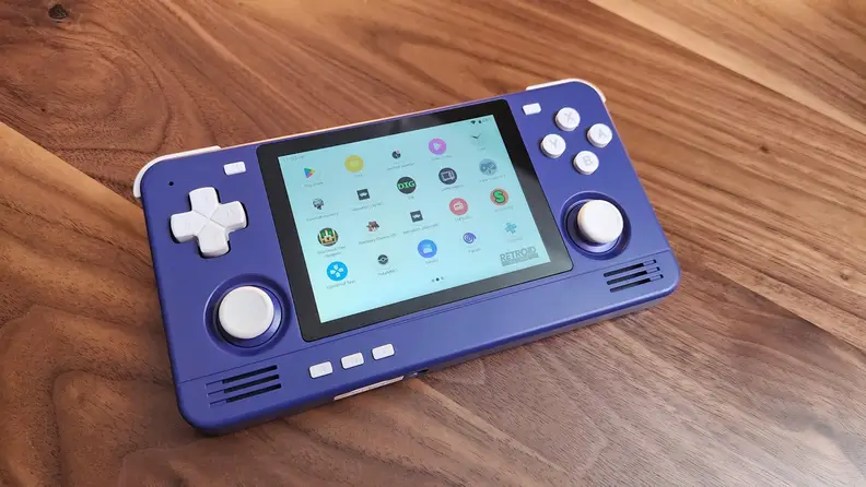 A view of the Retroid Pocket 2S handheld from the top on wooden surface.