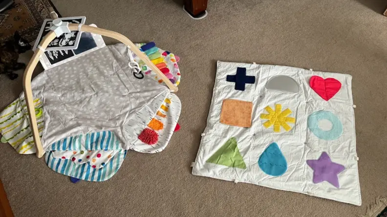 Lovevery play mat next to the KiwiCo play mat