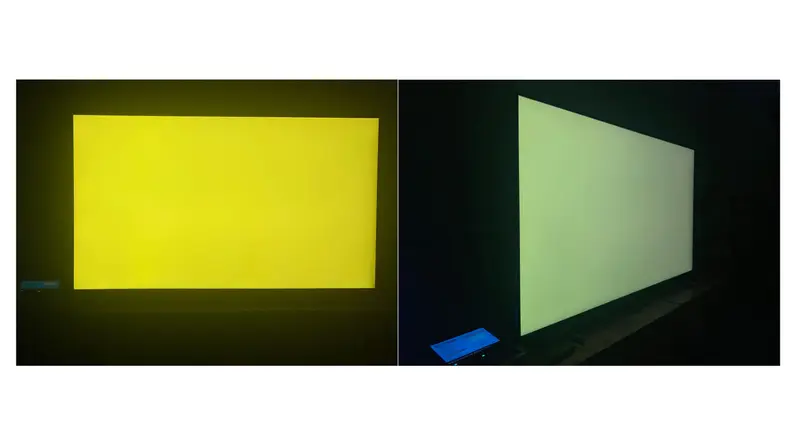 A side-by-side comparison of the Samsung Q60B displaying a pure yellow screen from a head-on angle and an off-axis position