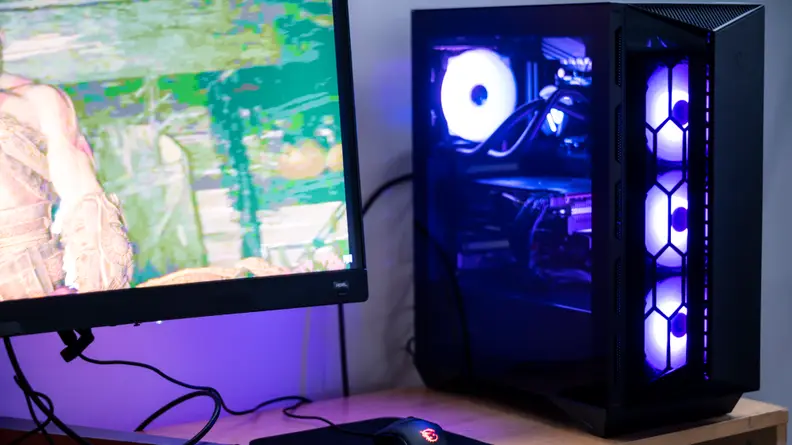 A desktop PC and a display on a desk.