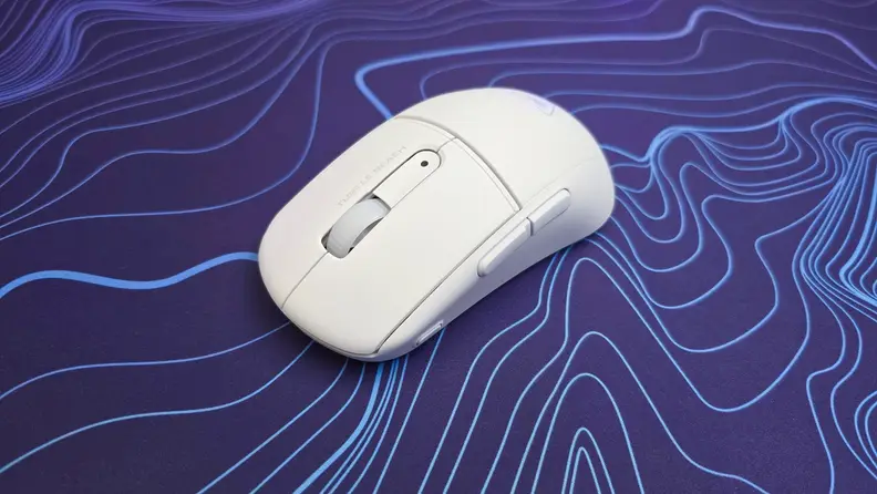 Close up angled view of the Turtle Beach Burst II Air mouse on top of a purple and blue patterned mousepad.