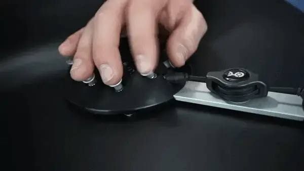 Person using single hand to operate the keys on the black Charachorder keyboard.