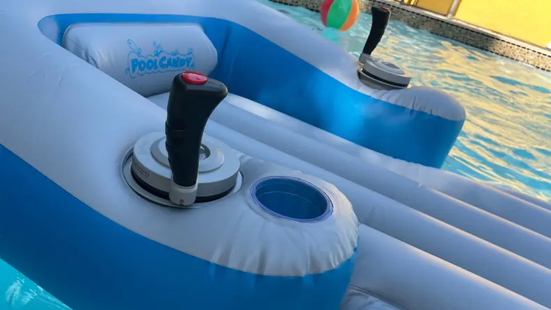 Close-up shot of the joysticks on the Sharper Image motorized pool float on top of pool water.