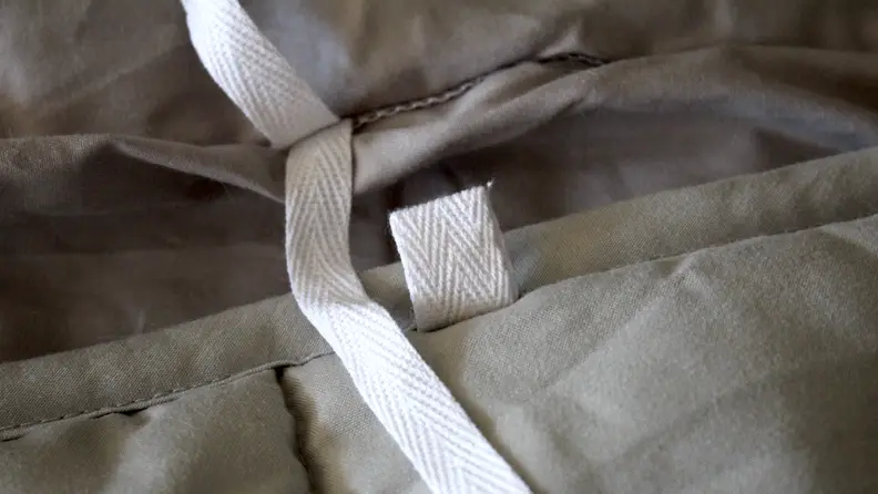 The blanket's cover is quite cumbersome to put on.
