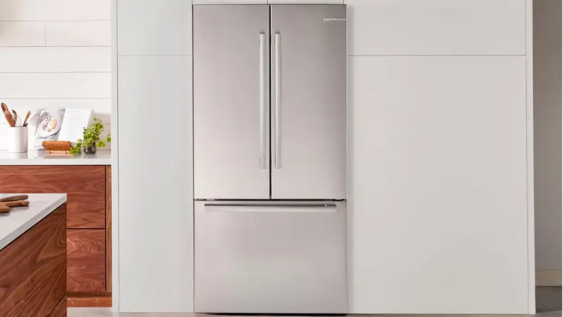 The Bosch B36CT80SNS fridge in a white kitchen.