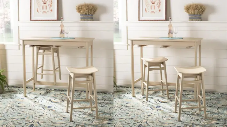 Small dinner table with stool hooked onto bottom of table.