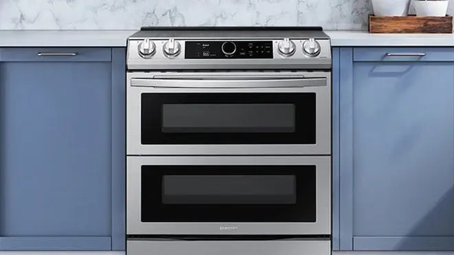 Silver stovetop/oven in neutral kitchen