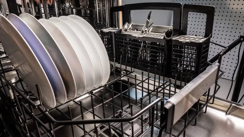 A shot of the GE Café CDT875M5NS5 dishwasher's lower rack, with some dishes loaded in.
